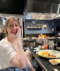 A smiling woman in our supported living services accessing her community